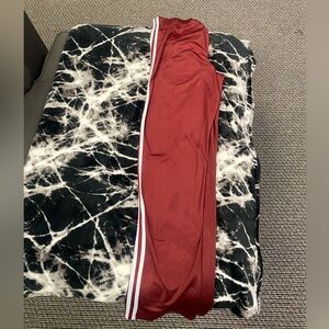 red and white athletic track pants